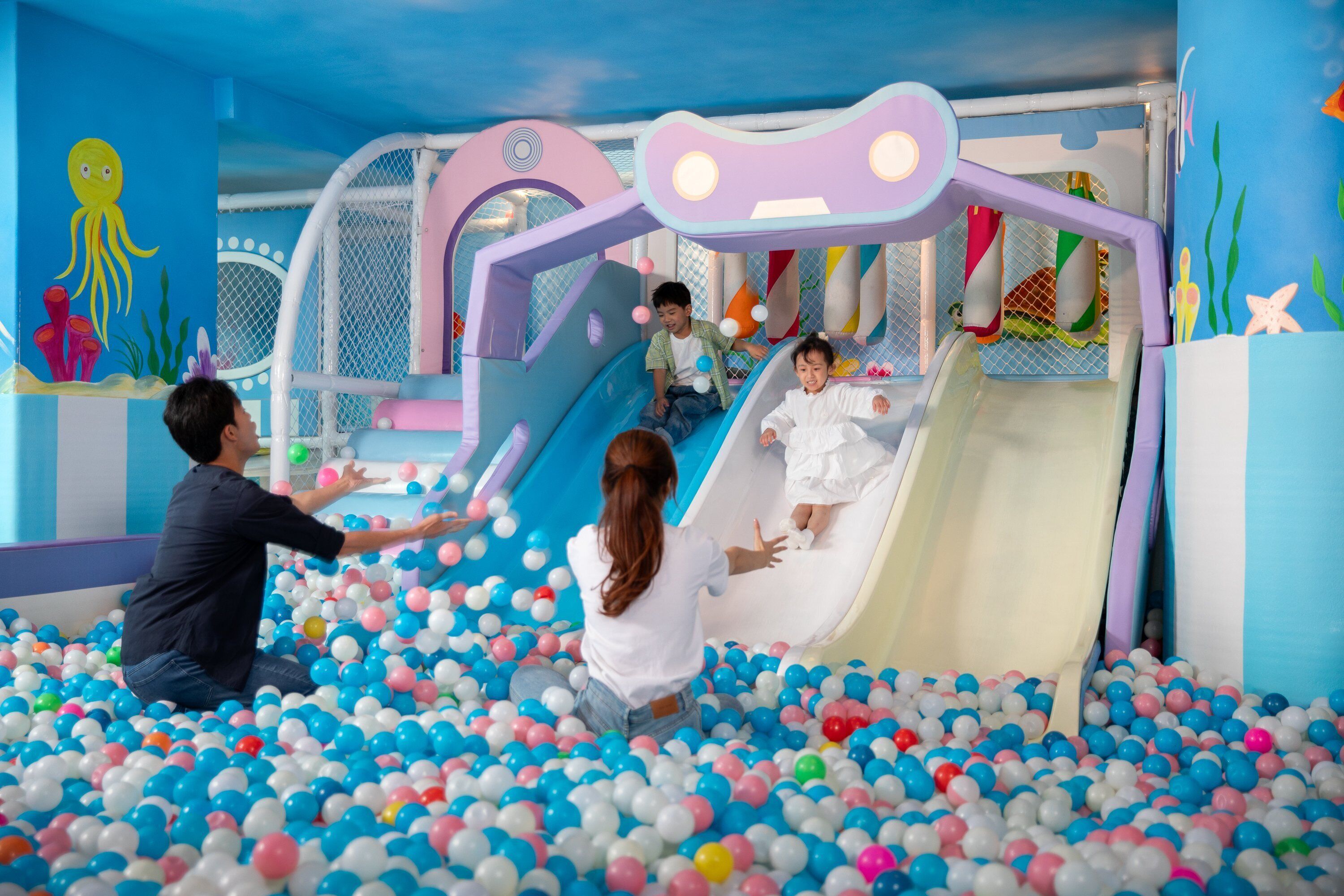 A children's play area with slides and a ball pit.