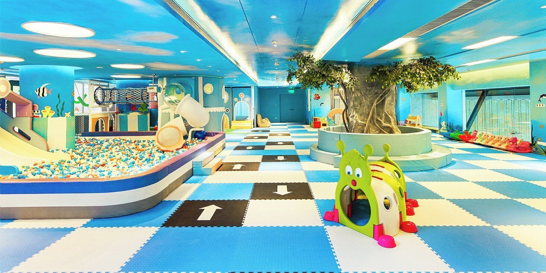 A children's play area with a ball pit, slides, and a play structure.