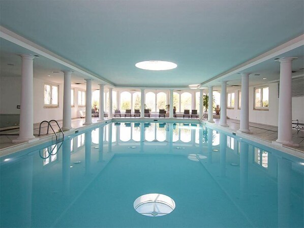 Indoor pool, open 9 AM to 7 PM, pool loungers