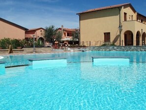 Outdoor pool, pool umbrellas, sun loungers