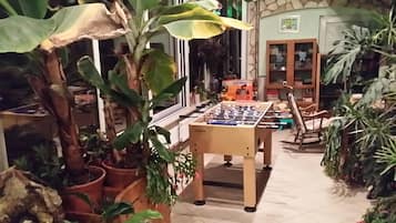 Relax in this inviting space with a foosball table and comfortable seating.