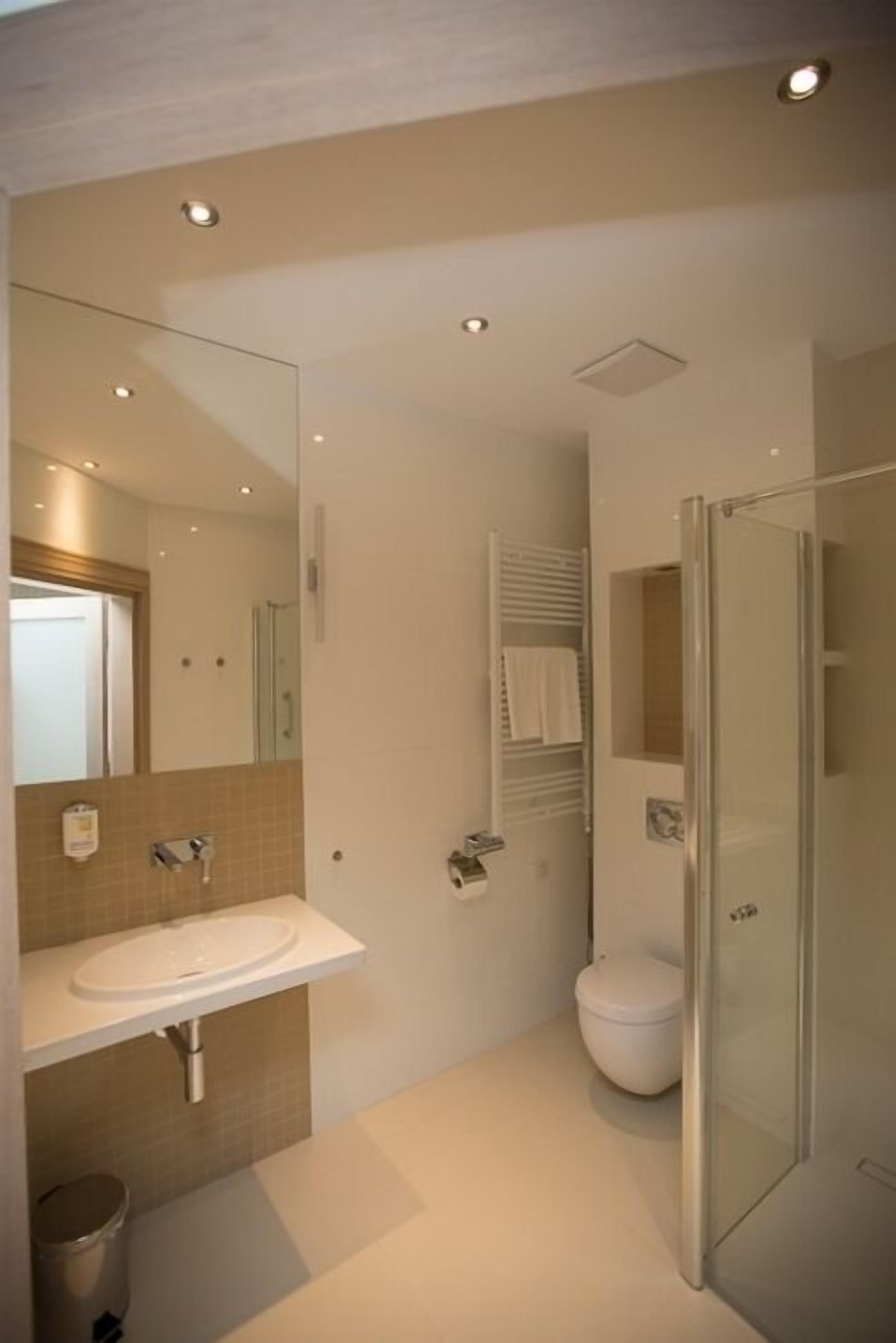 rainfall showerhead, hair dryer, bathrobes, slippers