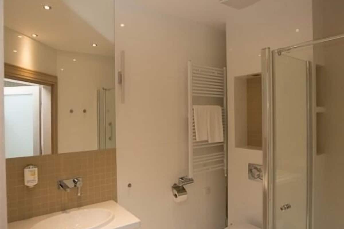 rainfall showerhead, hair dryer, bathrobes, slippers