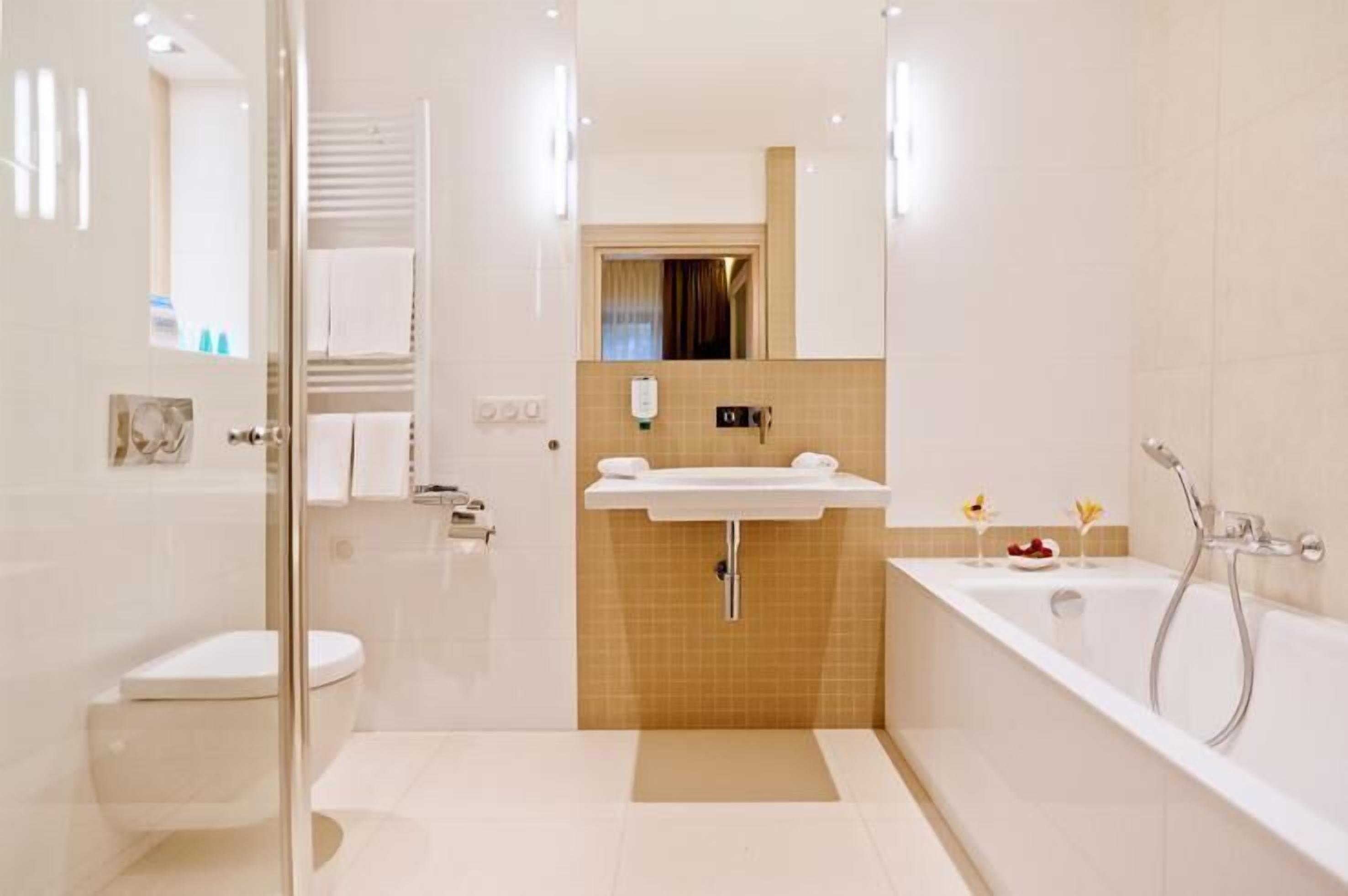 rainfall showerhead, hair dryer, bathrobes, slippers