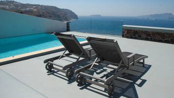 Indoor pool, seasonal outdoor pool, pool umbrellas, pool loungers