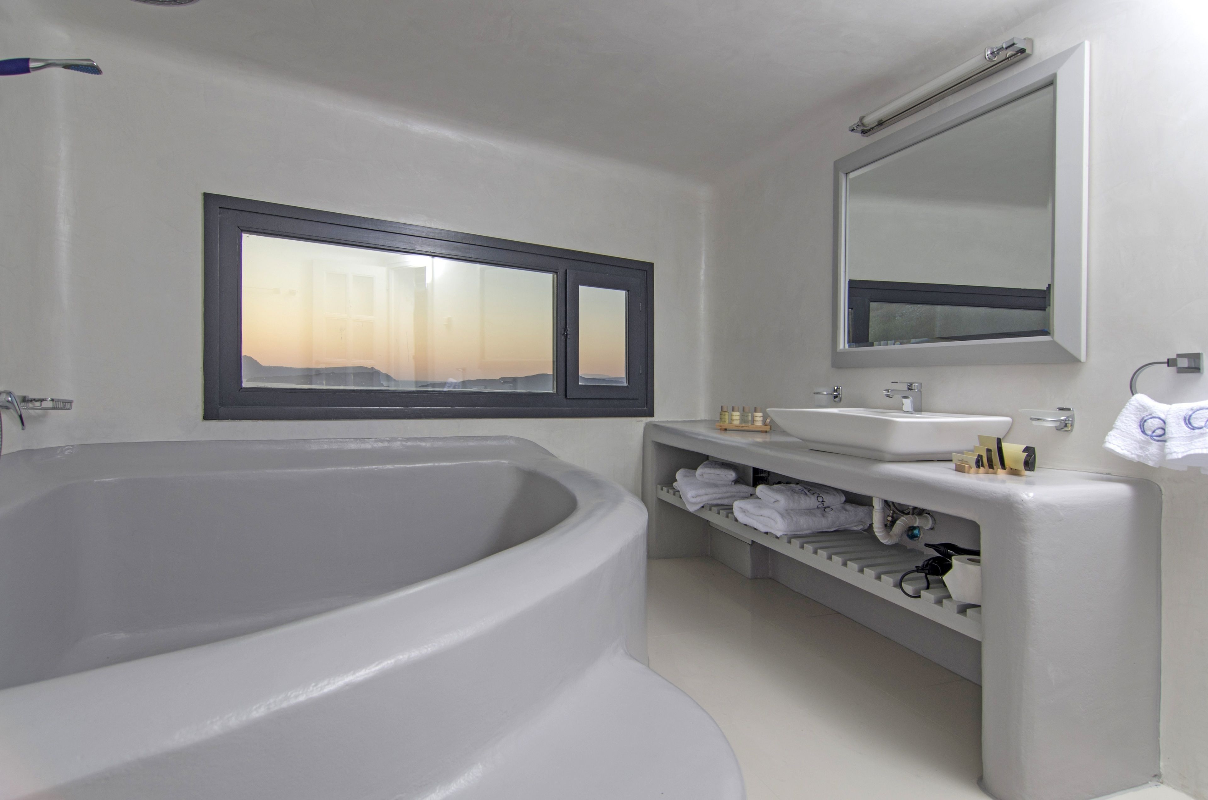 designer toiletries, hair dryer, bathrobes, slippers