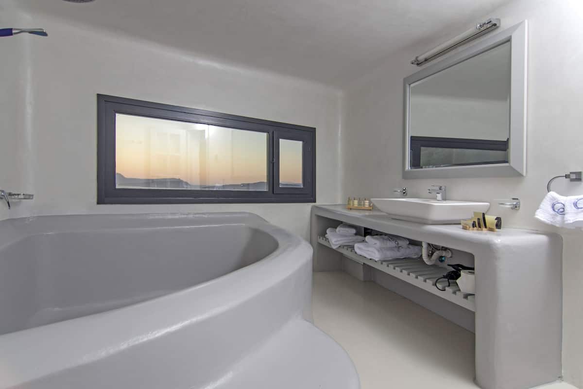 designer toiletries, hair dryer, bathrobes, slippers