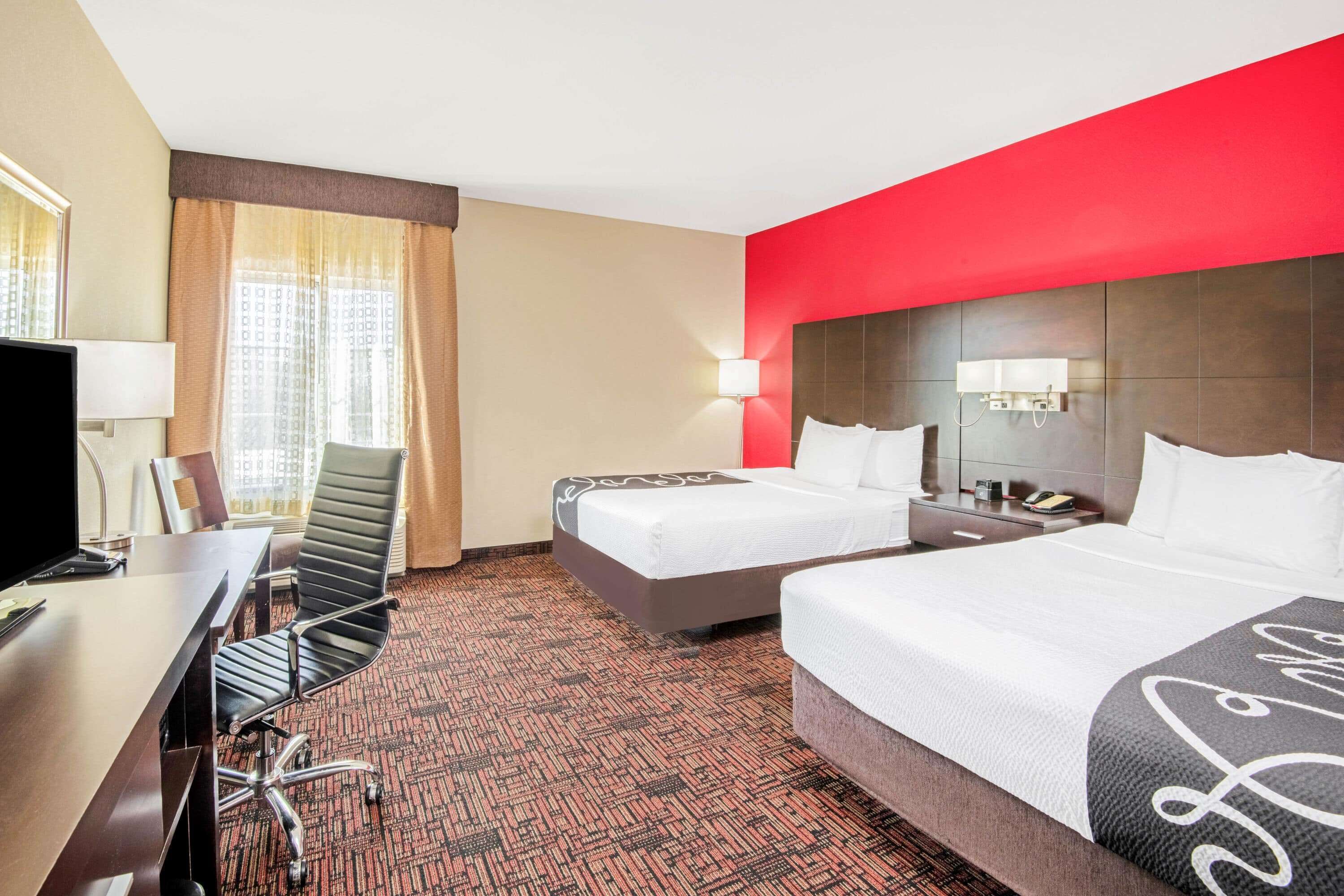 premium bedding, pillow-top beds, desk, laptop workspace