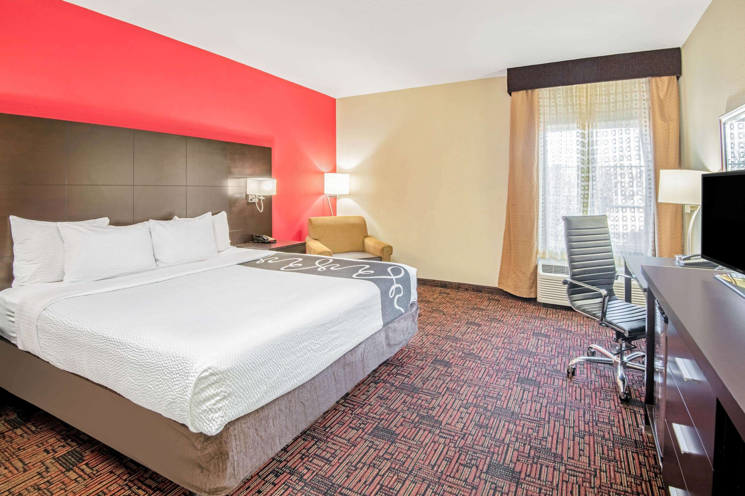 premium bedding, pillow-top beds, desk, laptop workspace