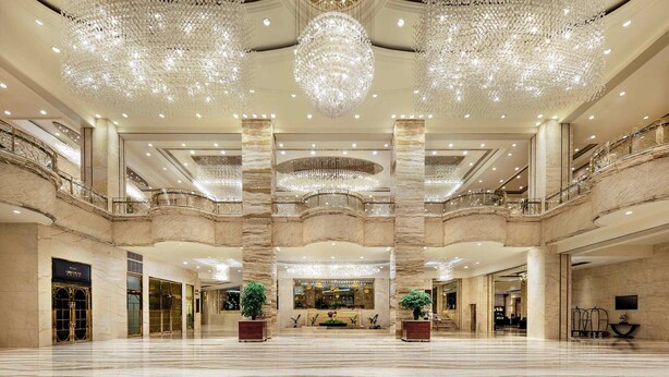 A spacious lobby with marble floors, large chandeliers, and a grand staircase. - InterContinental Chengdu Global Center by IHG (Chengdu)