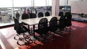 A conference room with a large table and chairs, large windows, and a whiteboard. - Hanting Express Dandong Train Station (Dandong)