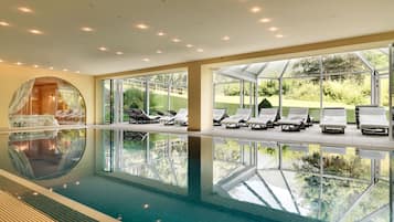 Indoor pool, pool umbrellas, pool loungers