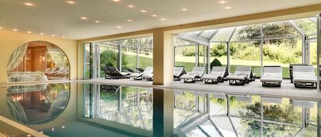 Indoor pool, pool umbrellas, pool loungers