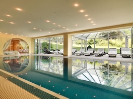 Indoor pool, pool umbrellas, sun loungers