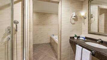 Suite with King Size Bed | Bathroom | Separate tub and shower, hydromassage showerhead, free toiletries