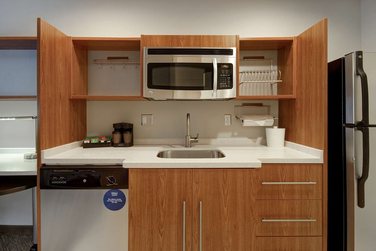 full-sized fridge, microwave, dishwasher, coffee/tea maker