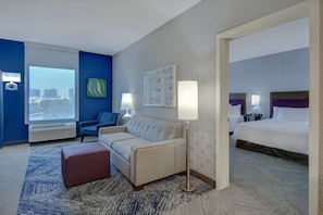 Suite, 2 Queen Beds, Non Smoking | Living area | 55-inch LCD TV with cable channels, TV, iPod dock