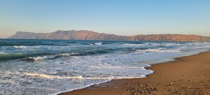 On the beach, sun-loungers, beach umbrellas, beach towels
