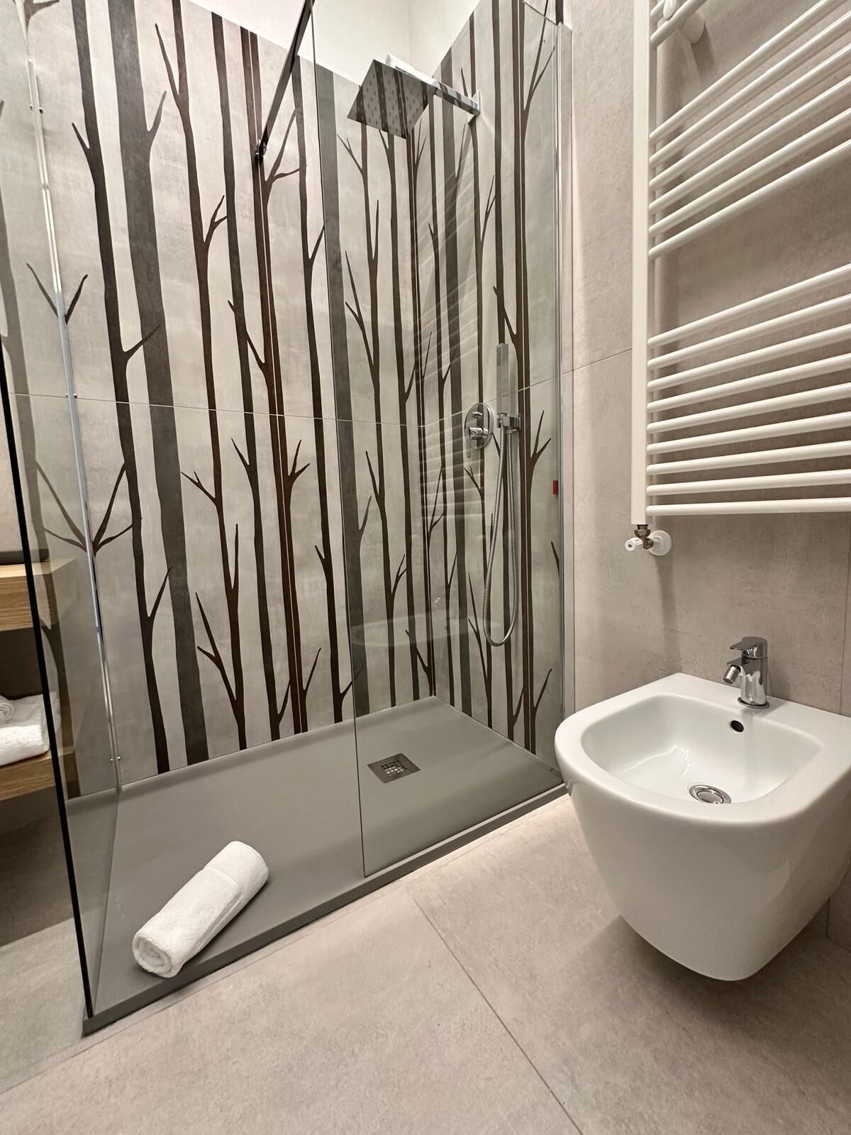 superior triple room | bathroom | shower, hair dryer, bidet, towels