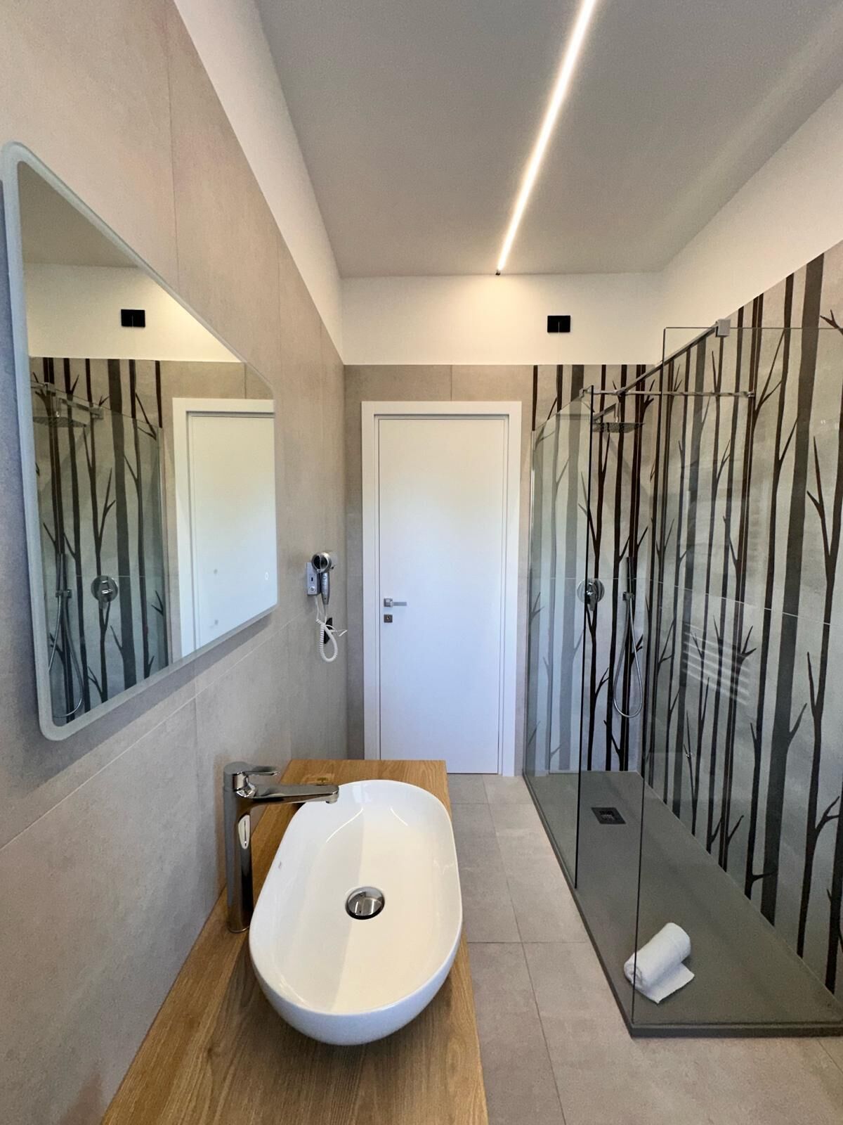 superior triple room | bathroom | shower, hair dryer, bidet, towels