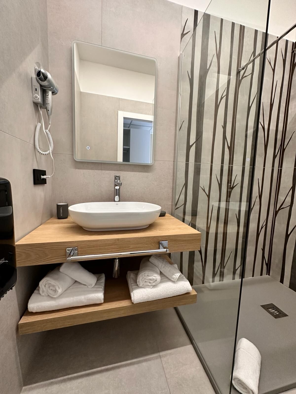 superior triple room | bathroom | shower, hair dryer, bidet, towels