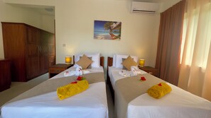 Apartment, Pool View | 2 bedrooms, in-room safe, blackout curtains, iron/ironing board - The Palm Seychelles (Mahé Island)