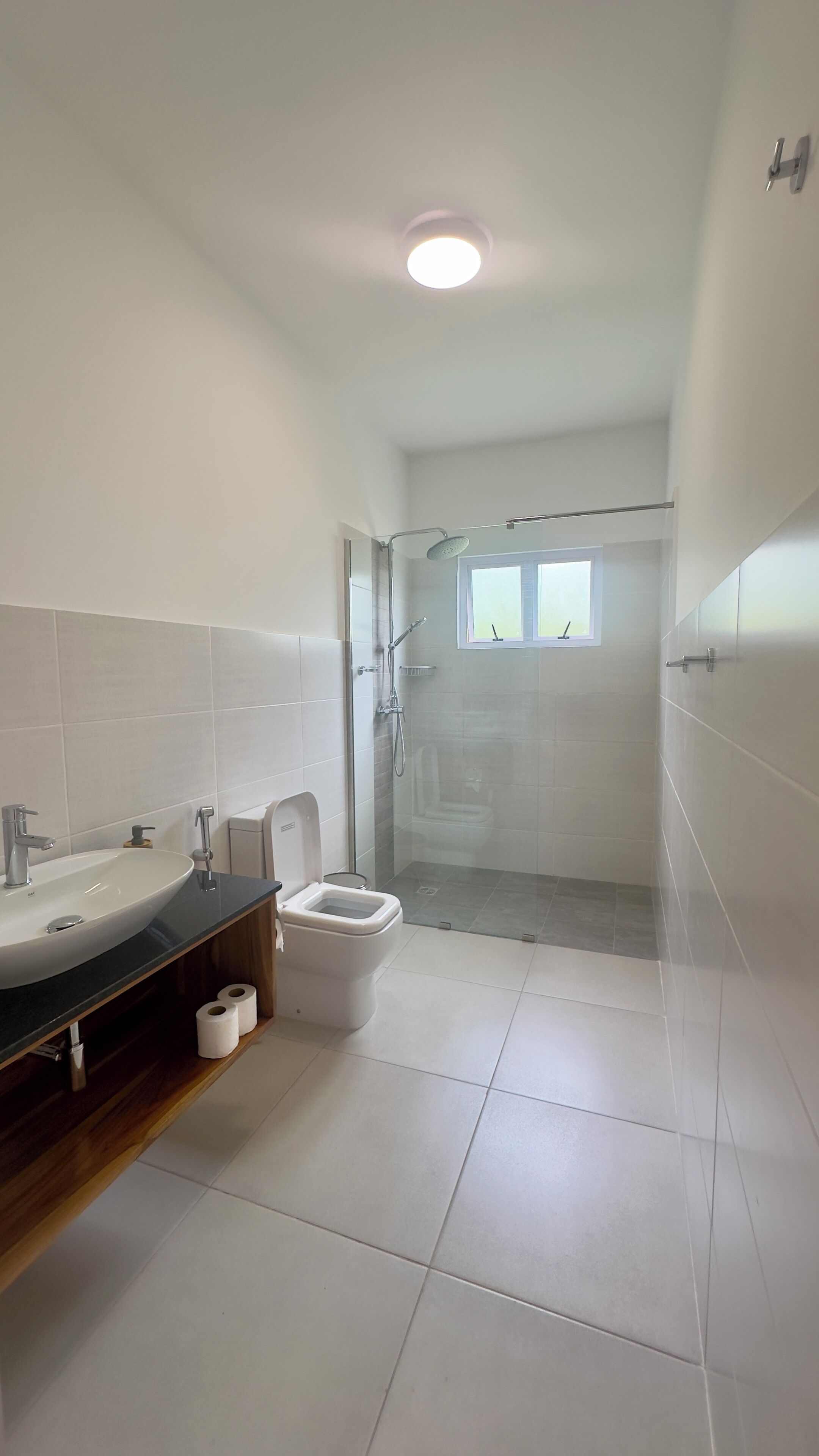 apartment, pool view | bathroom | shower, rainfall showerhead, hair dryer, towels