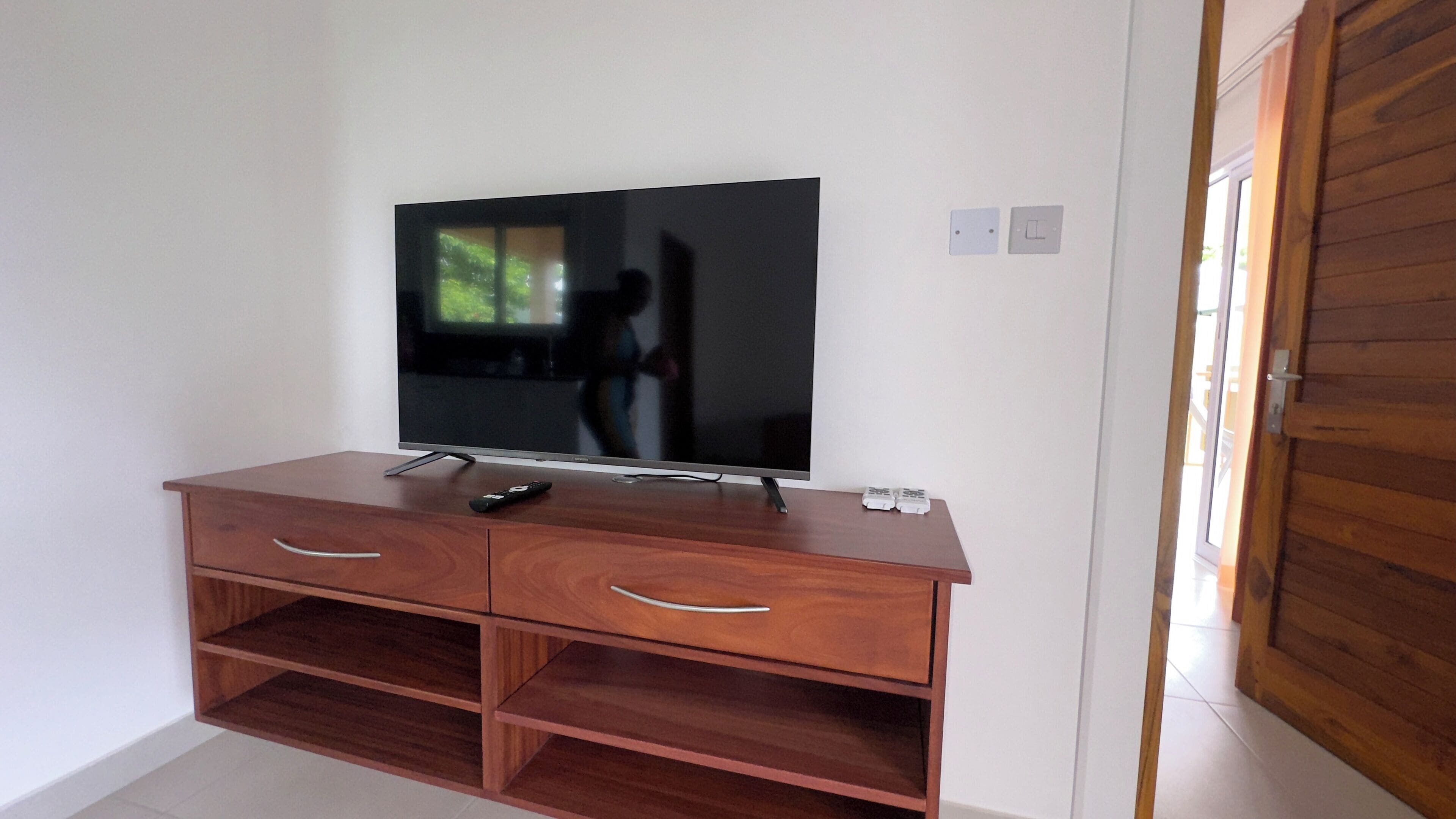 apartment, pool view | living area | 43-inch tv with cable channels