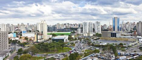 A cityscape with high-rise buildings, a central roundabout, and a mix of commercial and residential areas.