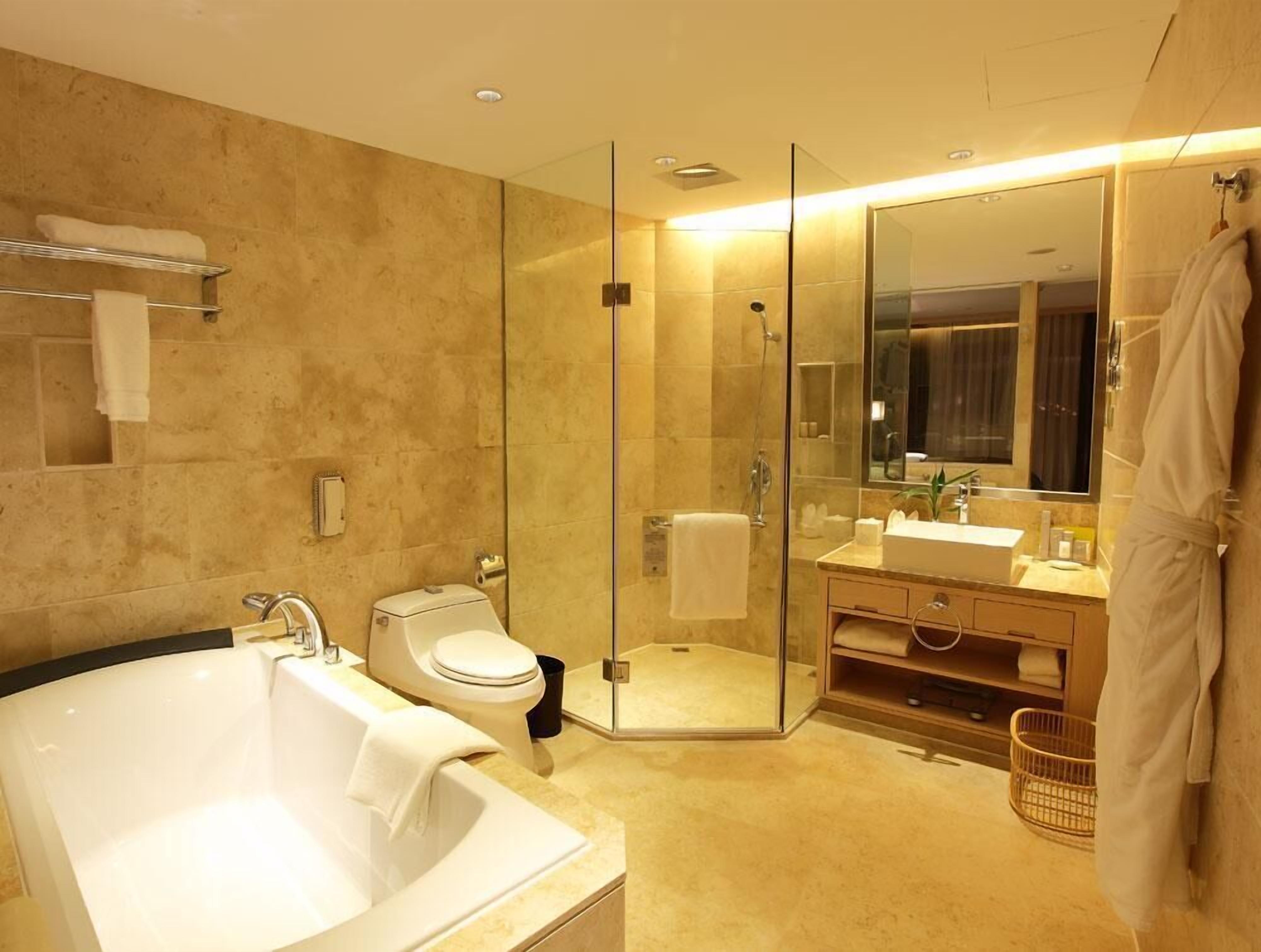 deluxe room | bathroom | separate bathtub and shower, deep-soaking bathtub, rainfall showerhead