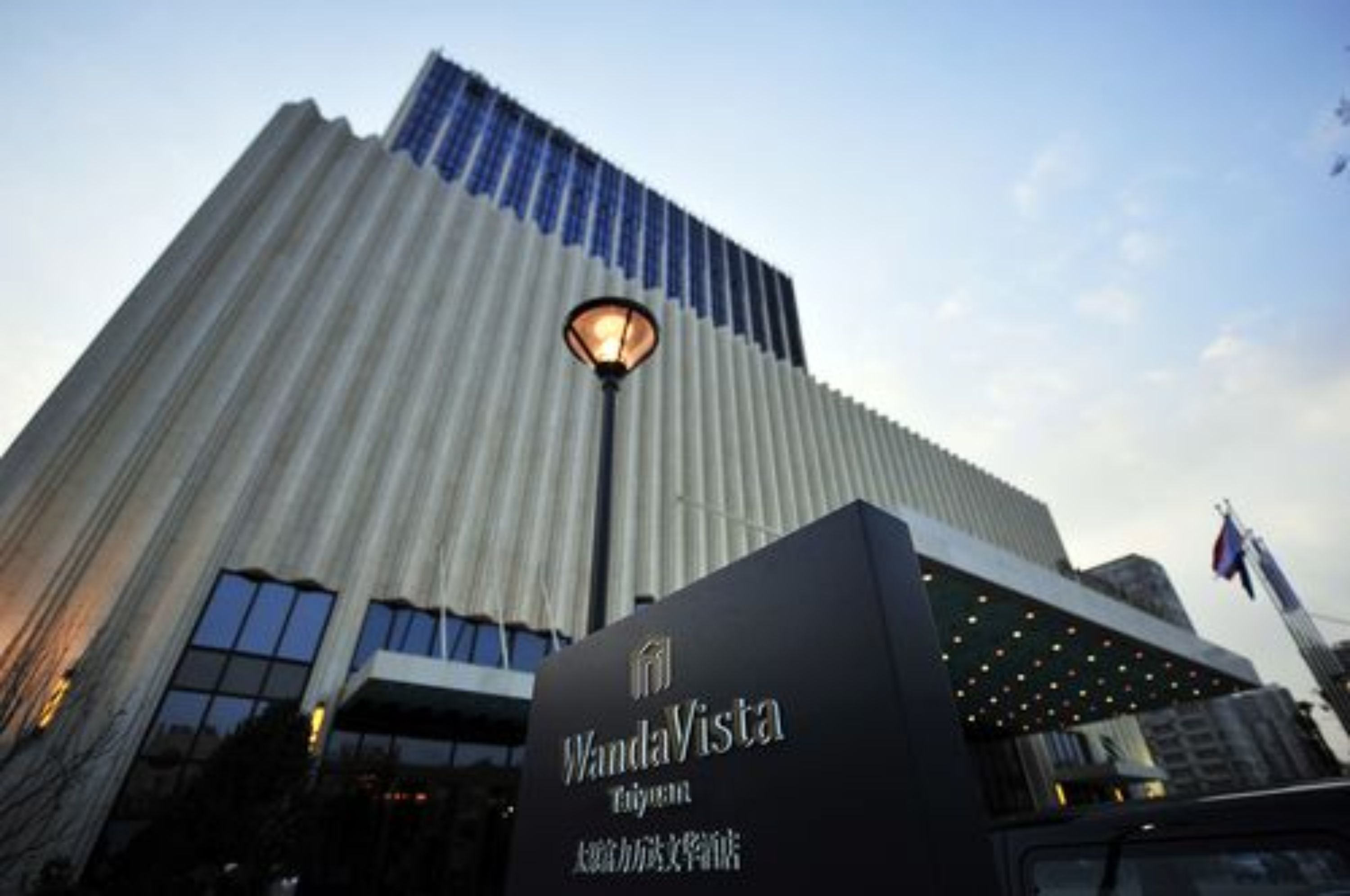 A tall building with a sign reading "WandaVista."
