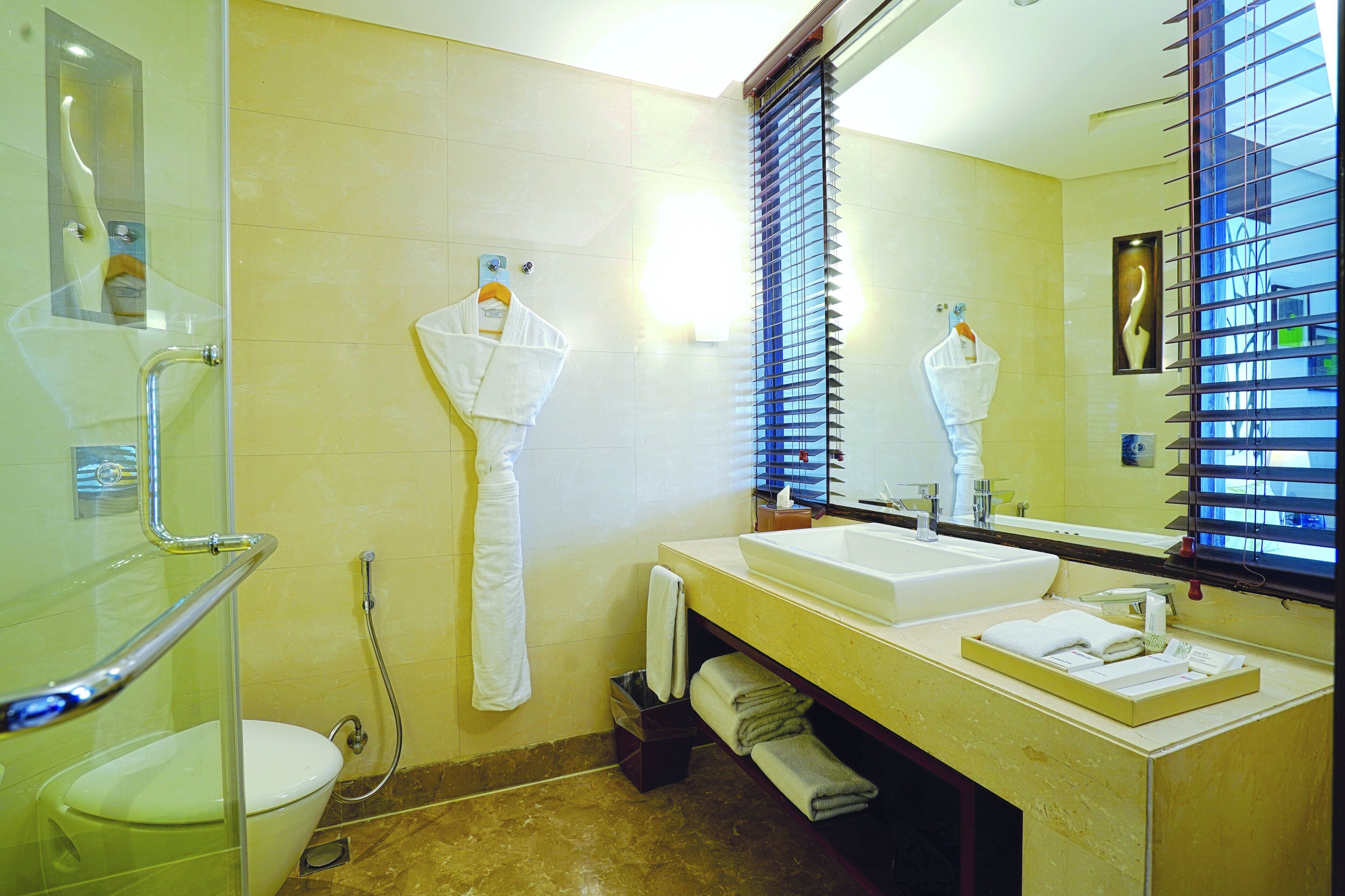 rainfall showerhead, hair dryer, bathrobes, slippers