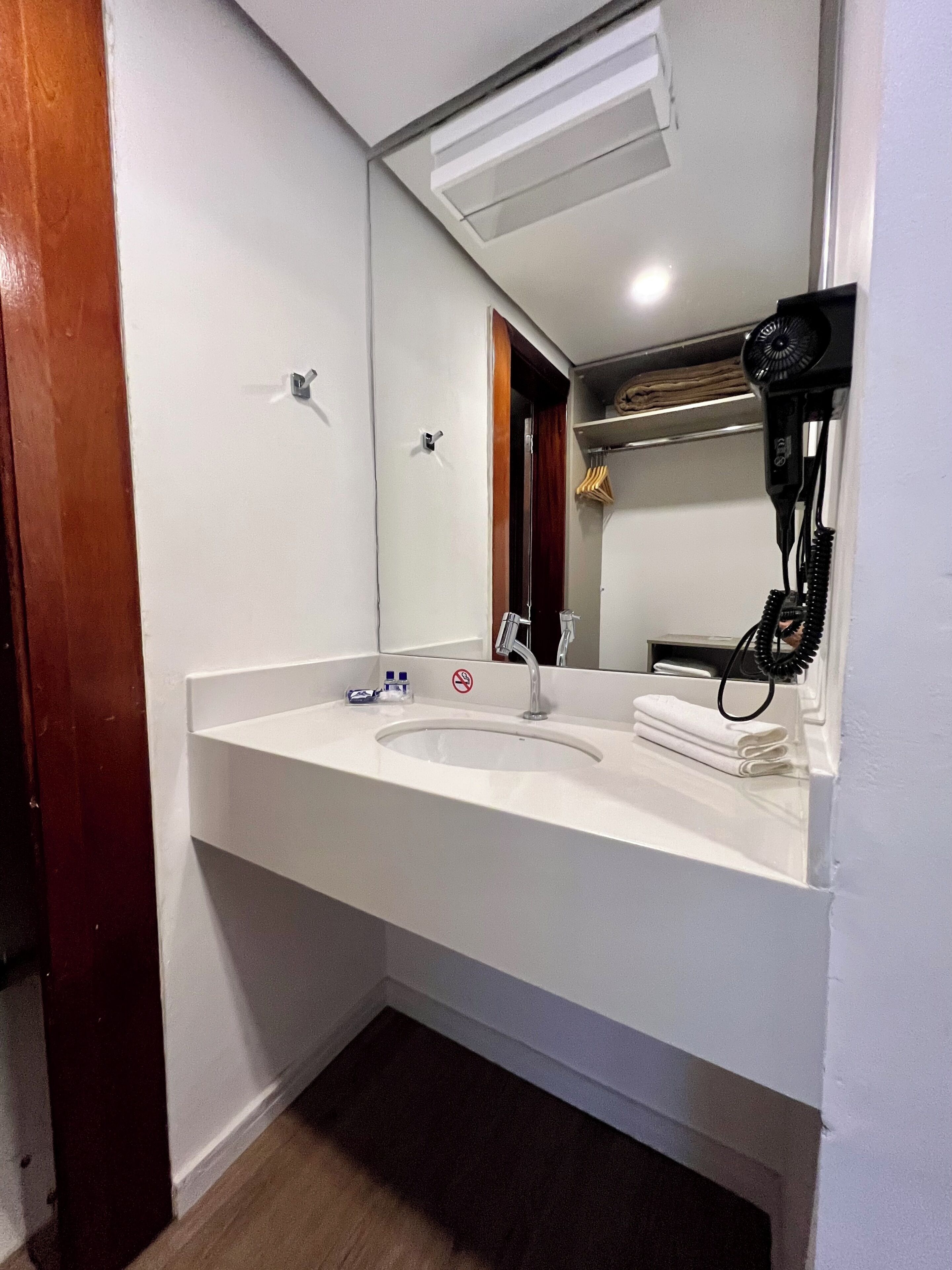 shower, designer toiletries, hair dryer, towels