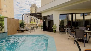 Outdoor pool, open 5:00 AM to 10:00 PM, sun loungers