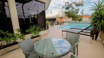 Outdoor pool, open 5:00 AM to 10:00 PM, sun loungers