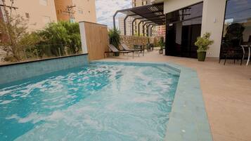 Outdoor pool, open 5:00 AM to 10:00 PM, sun loungers