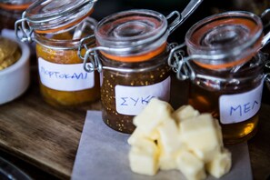Three glass jars with metal clasps, each labeled with handwritten text. - Six Keys Seaside Lodge (South Pelion)