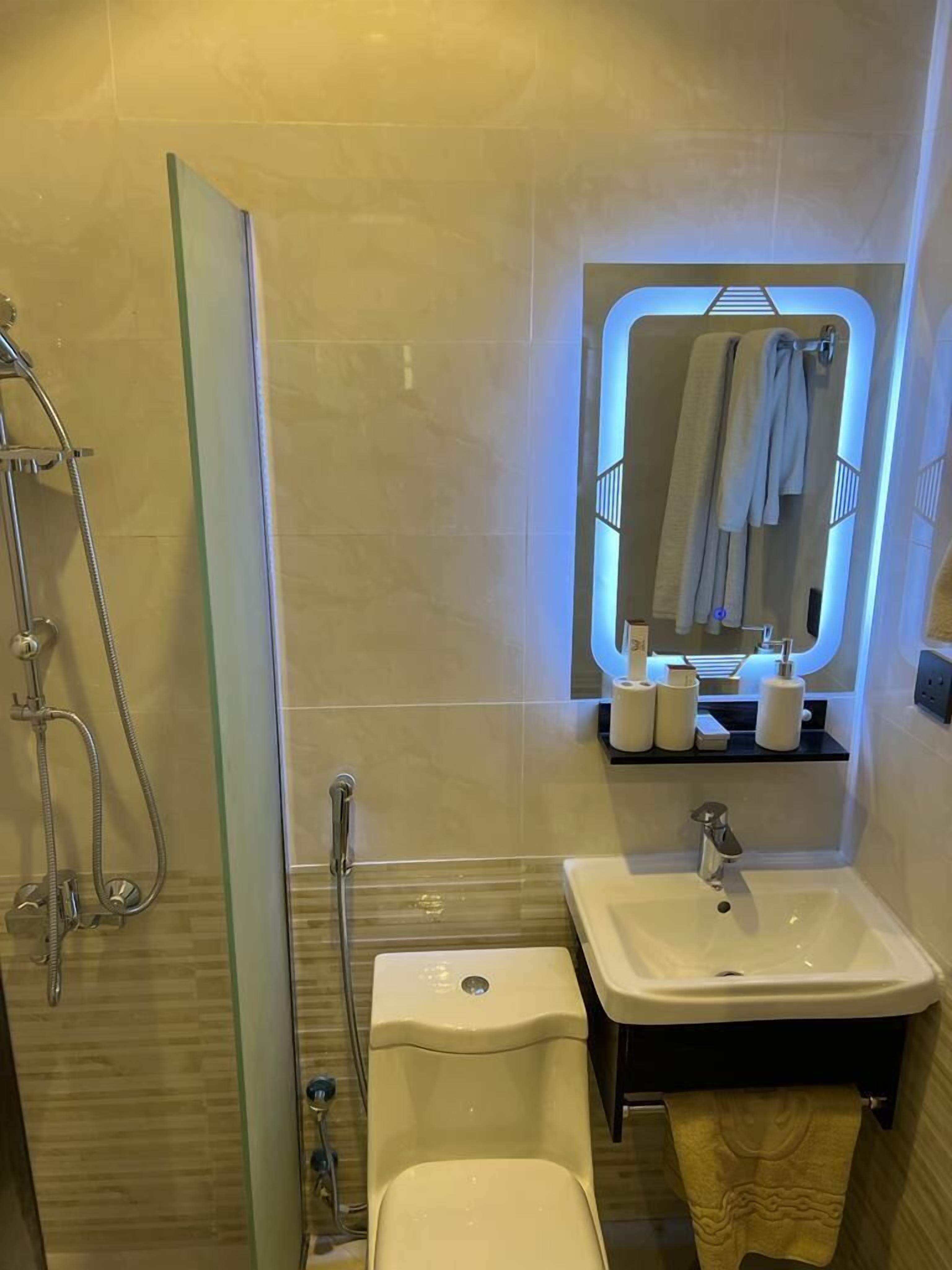 superior room | bathroom | shower, rainfall showerhead, hair dryer, bathrobes