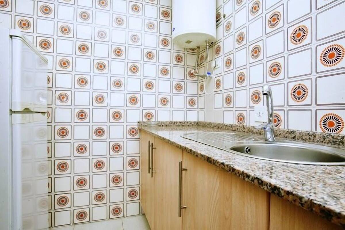 Fridge, microwave, cookware/dishes/utensils