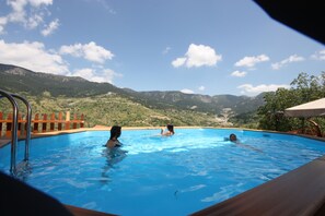 A swimming pool with a view of mountains. - Archontiko Metsovou Boutique Hotel (Metsovo)