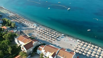 Beach nearby, white sand, sun loungers, beach umbrellas