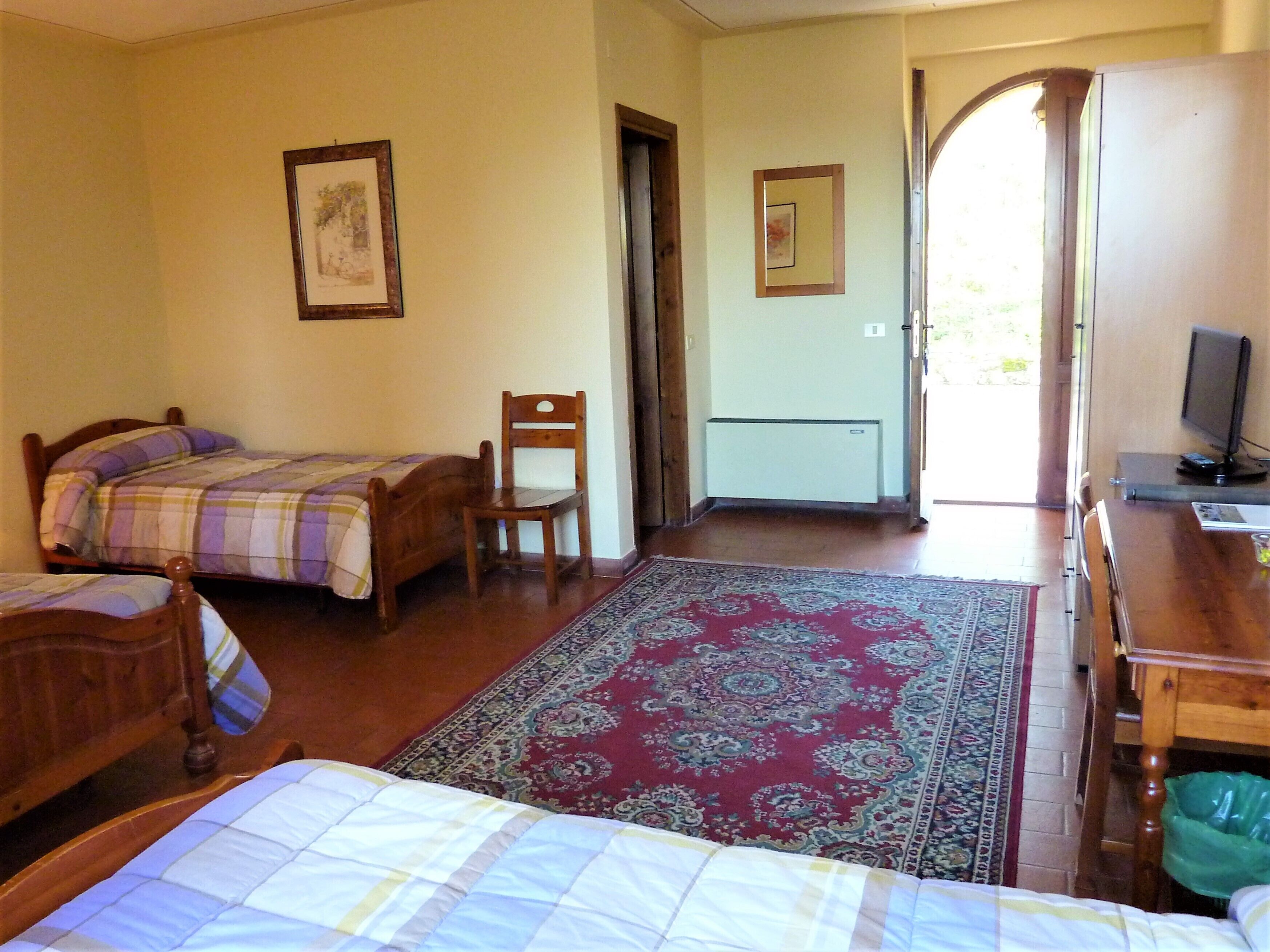 basic quadruple room | 1 bedroom, down duvets, minibar, desk