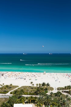 Private beach nearby, white sand, sun loungers, beach umbrellas at Gale South Beach, Curio Collection by Hilton