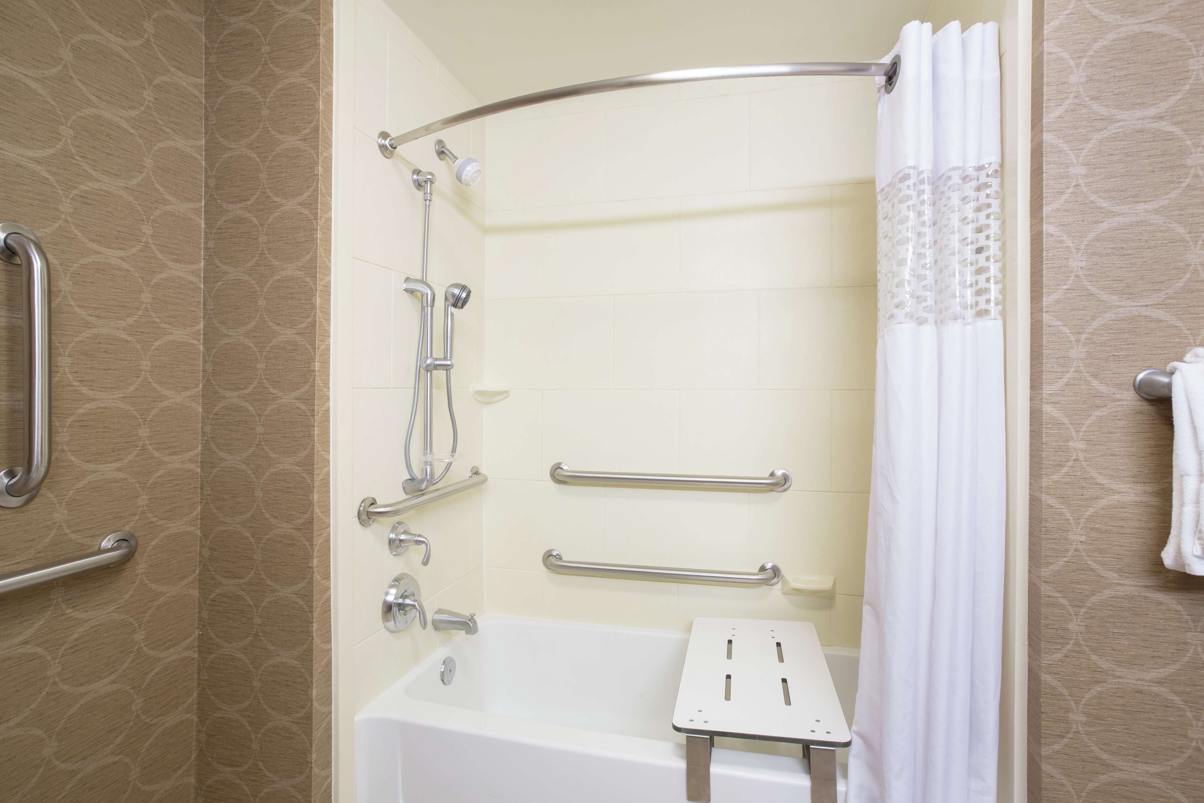 designer toiletries, hair dryer, towels, soap