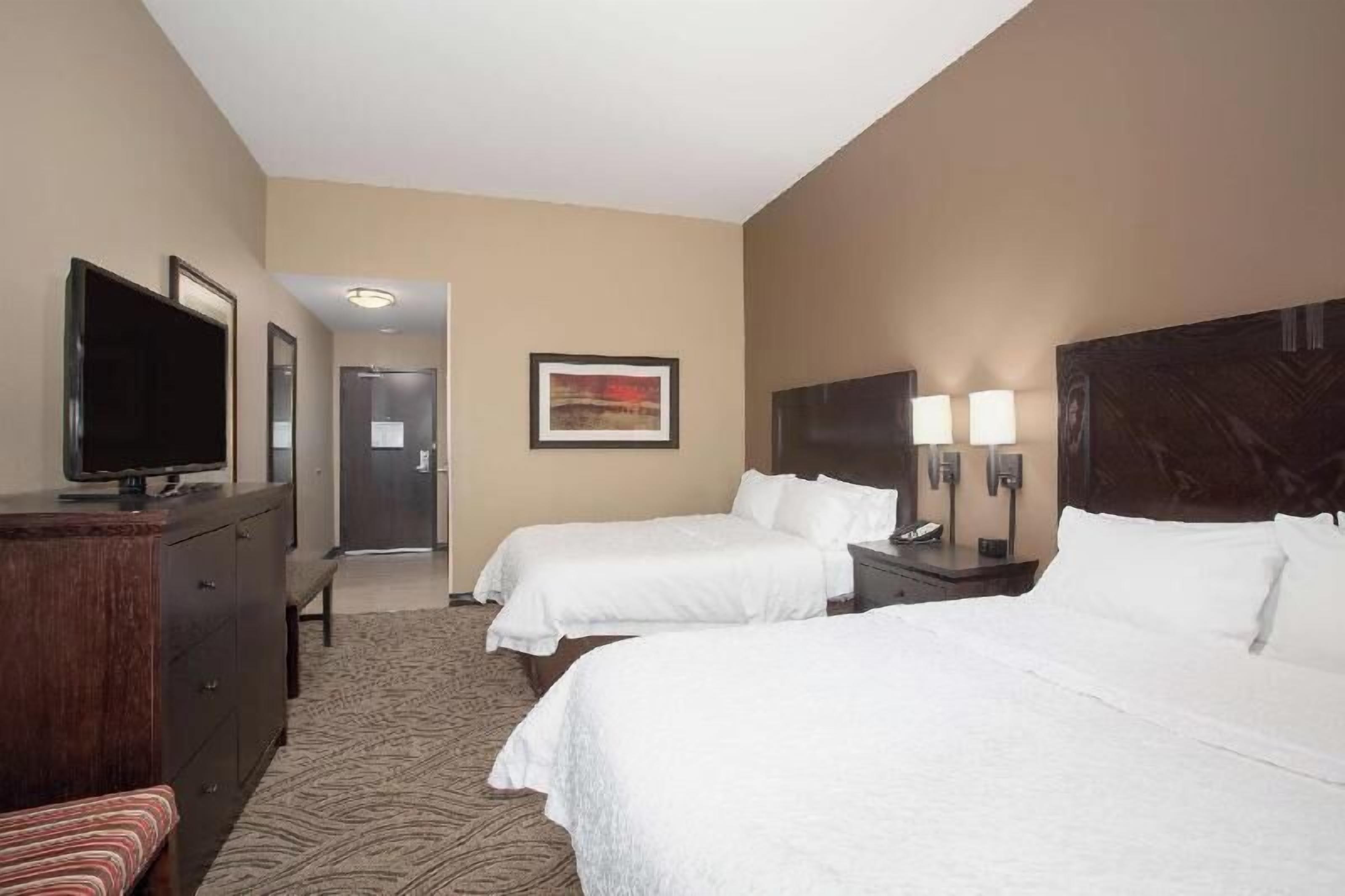 Hypo-allergenic bedding, pillowtop beds, desk, blackout drapes