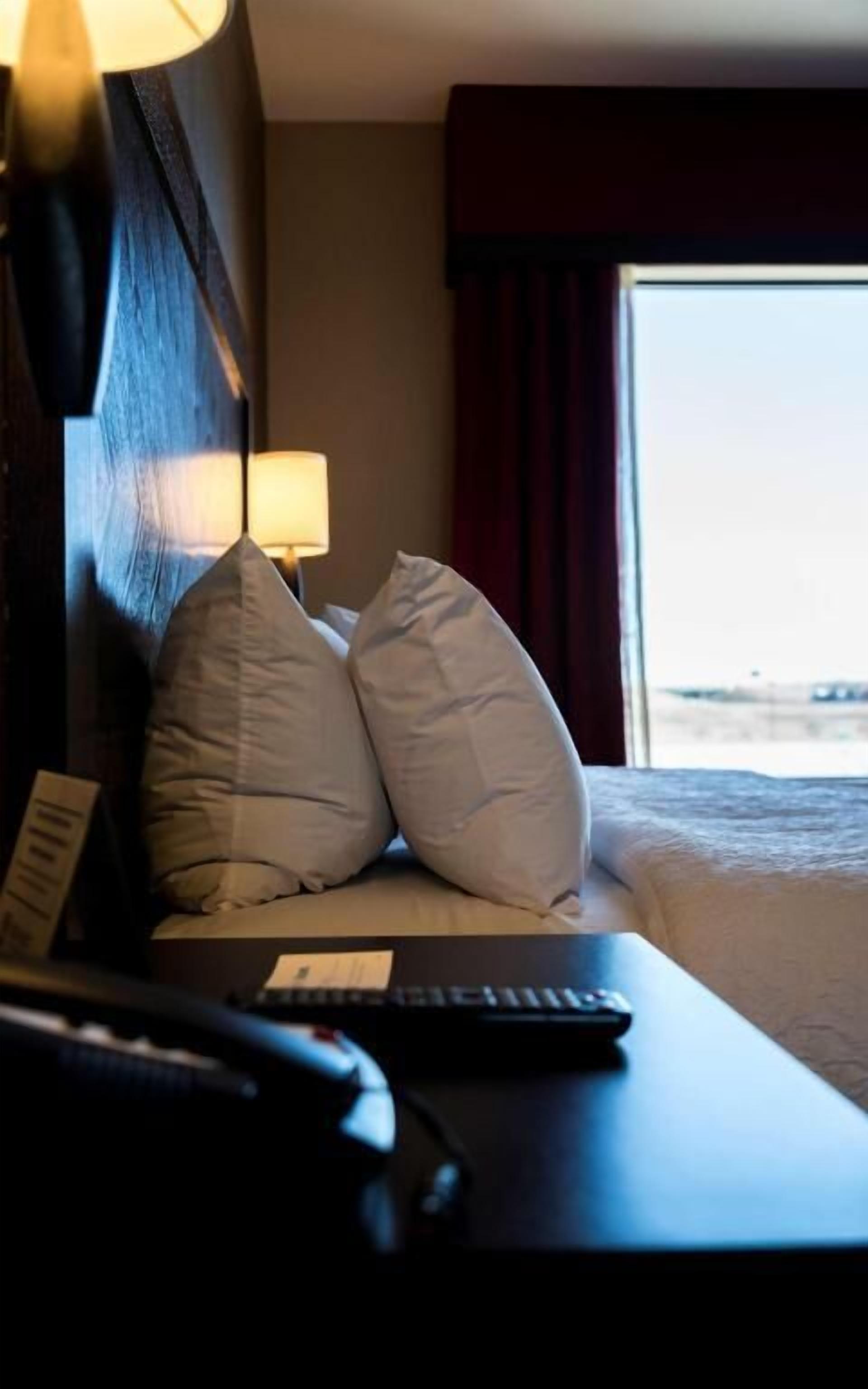 Hypo-allergenic bedding, pillowtop beds, desk, blackout drapes