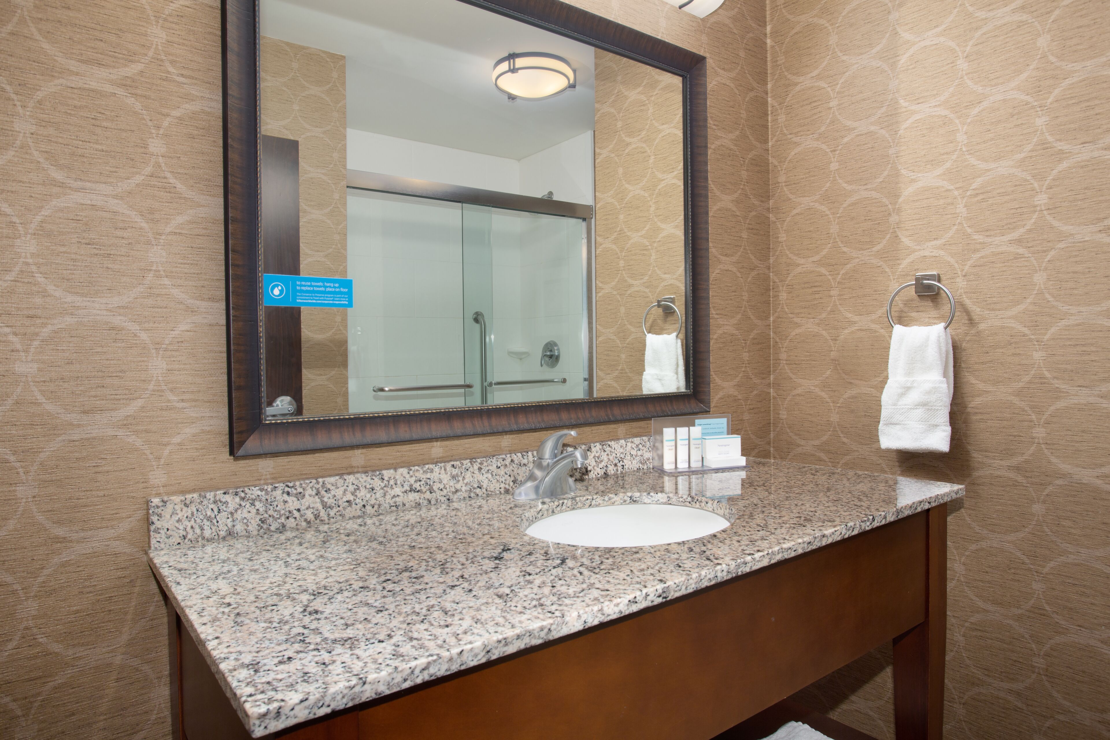 designer toiletries, hair dryer, towels, soap