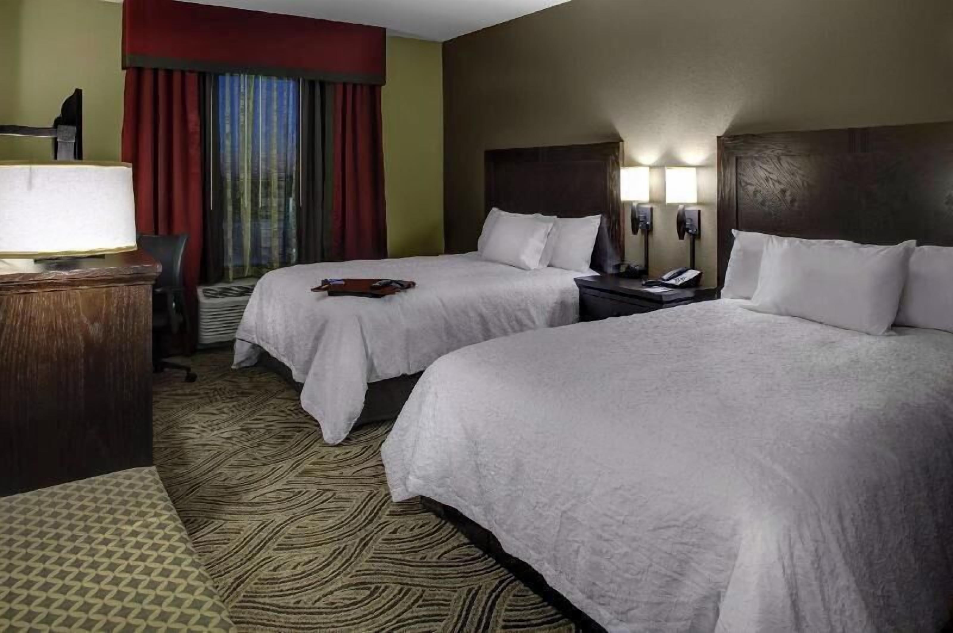 Hypo-allergenic bedding, pillowtop beds, desk, blackout drapes