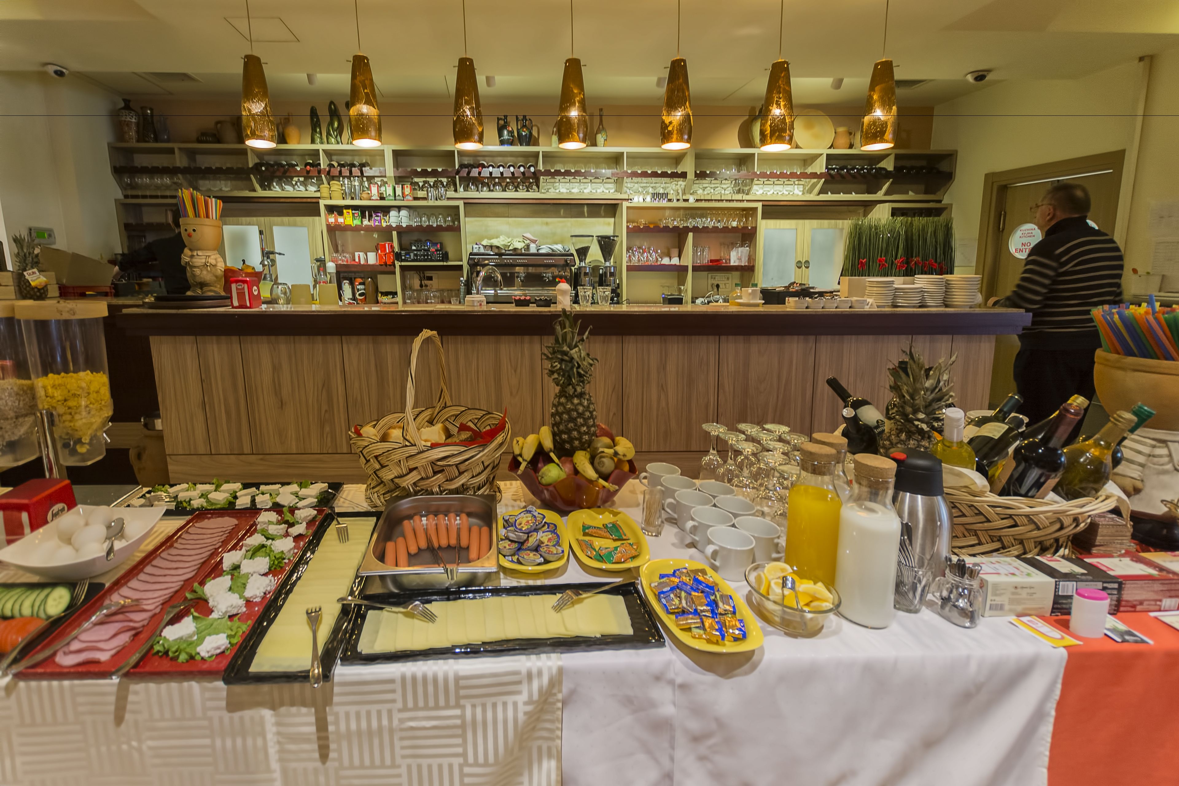 A buffet setup with various food items and beverages.