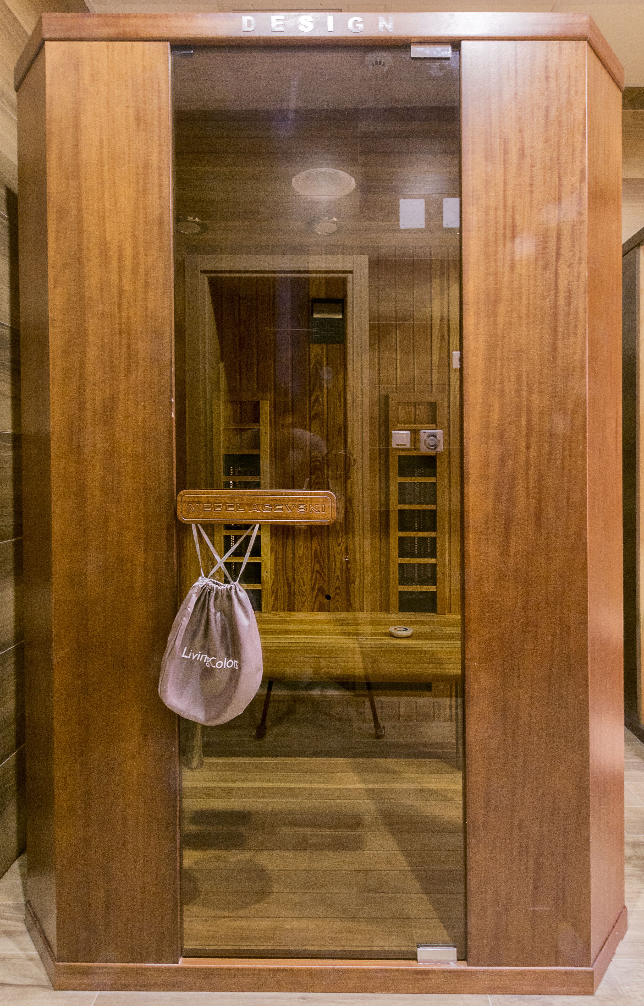 A wooden elevator with a sign reading "DESIGN" at the top.